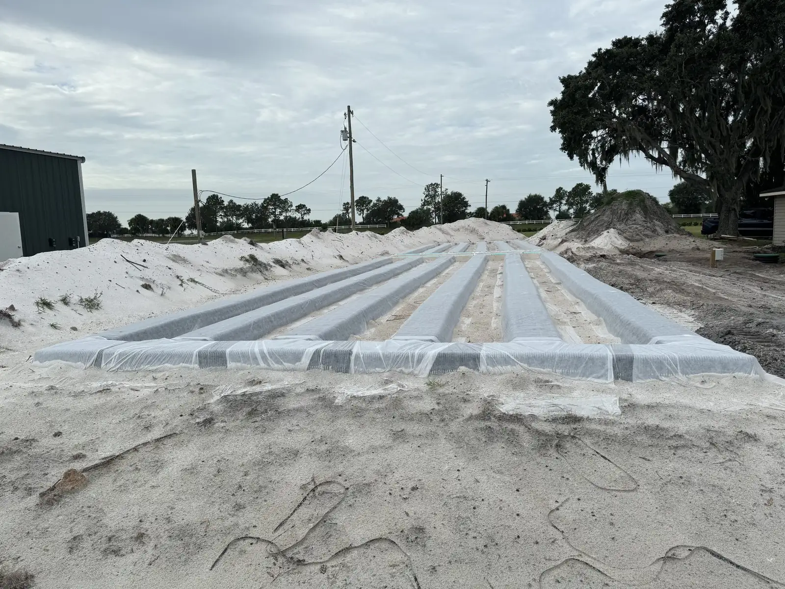 Rows of drain field chambers laid in sand at a large drain field installation